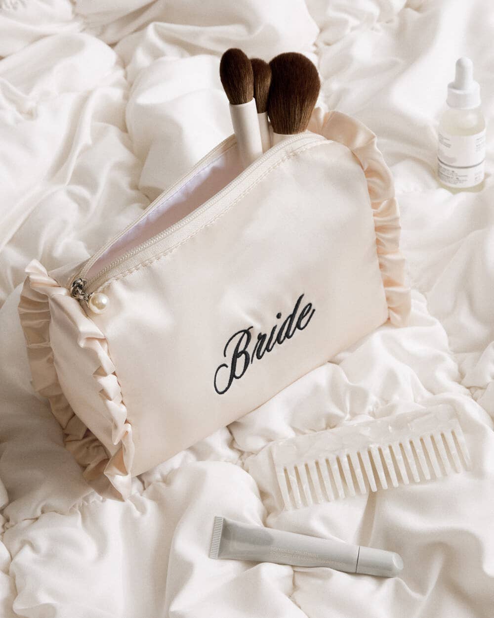 xo, Fetti - Embroidered Bride Satin Cosmetic Bag | bridal, ruffle, gift