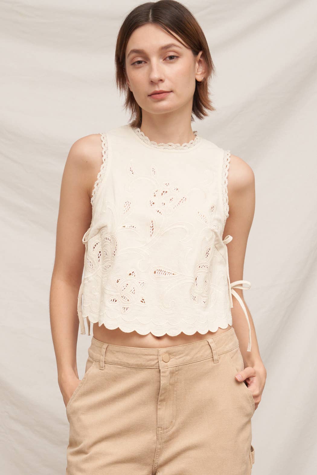 En Crème - Sleeveless Floral Embroidered Top with Side-Tie and Scallop